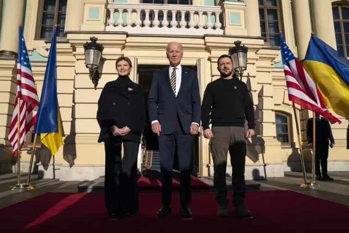 President Joe Biden, center, poses with Ukrainian President Volodymyr Zelenskyy, right, and Olena Zelenska, left, spouse of President Zelenskyy, at Mariinsky Palace during an unannounced visit in Kyiv, Ukraine, Monday, Feb. 20, 2023. (AP Photo)