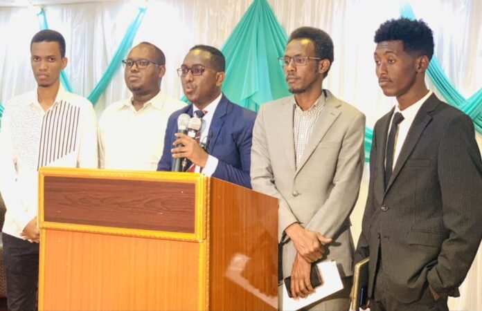 SJS Secretary-General, Abdalle Mumin (centre) speaks during a press briefing by the media advocates group in Mogadishu after the court sham trial ended on Monday February 13, 2023. | PHOTO/SJS.