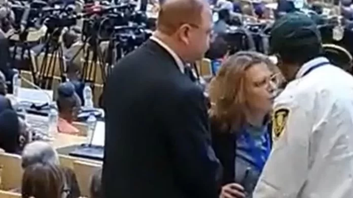 The video shows diplomat Sharon Bar-li being escorted out.