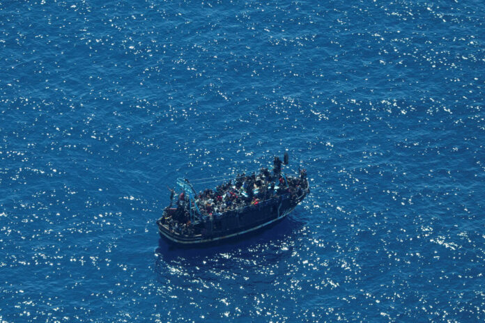 A boat in distress in the Mediterranean yesterday, in a photograph released by Sea-Watch International, a German organization.Giacomo Zorzi/Sea-Watch International, via Reuters