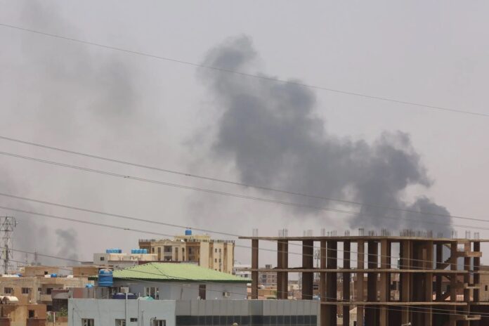 Smoke billows behind residential buildings in Khartoum on Monday, the third day of fighting between rival military factions in Sudan.Credit...Agence France-Presse — Getty Images