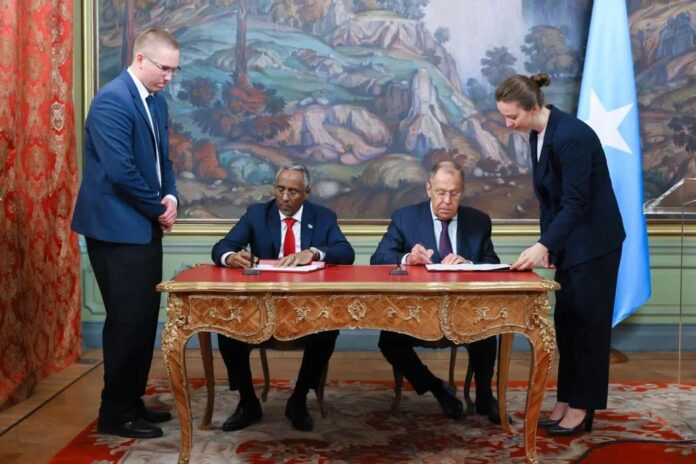 Somalia foreign minister Abshir Omar (left) signs a yet-to-be disclosed agreement with Russian counterpart Sergey Lavrov in Moscow on Friday 26 May 2023.