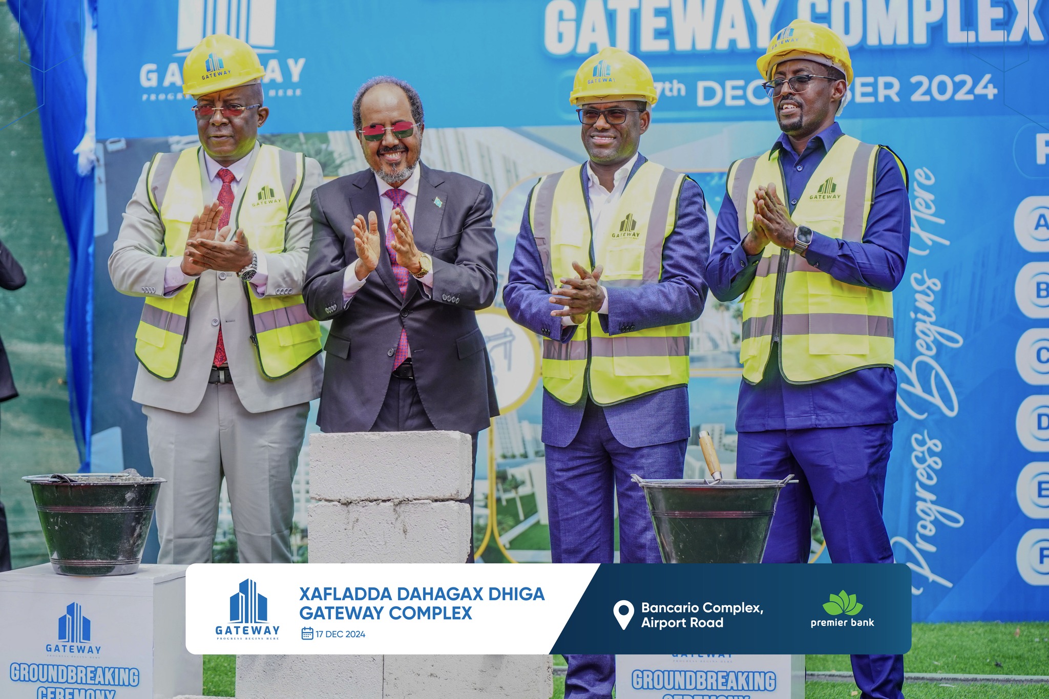 In this photo taken on December 17, 2024, Somali President Hassan Sheikh Mohamud is seen participating in the launch of a new hotel and mall construction project by Premier Bank on public land, following the eviction of vulnerable families in Mogadishu.