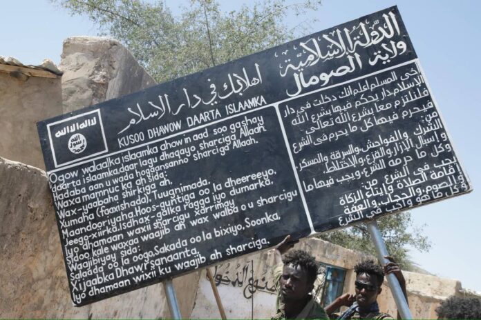 This banner from Sheebaab, a remote village under ISIS rule in the Cal_Miskaad mountains, Somalia, reflects the group's harsh governance. On Monday, Puntland counterterrorism forces took control of Sheebaab town, a significant ISIS stronghold deep in the Cal Miskaad mountains.