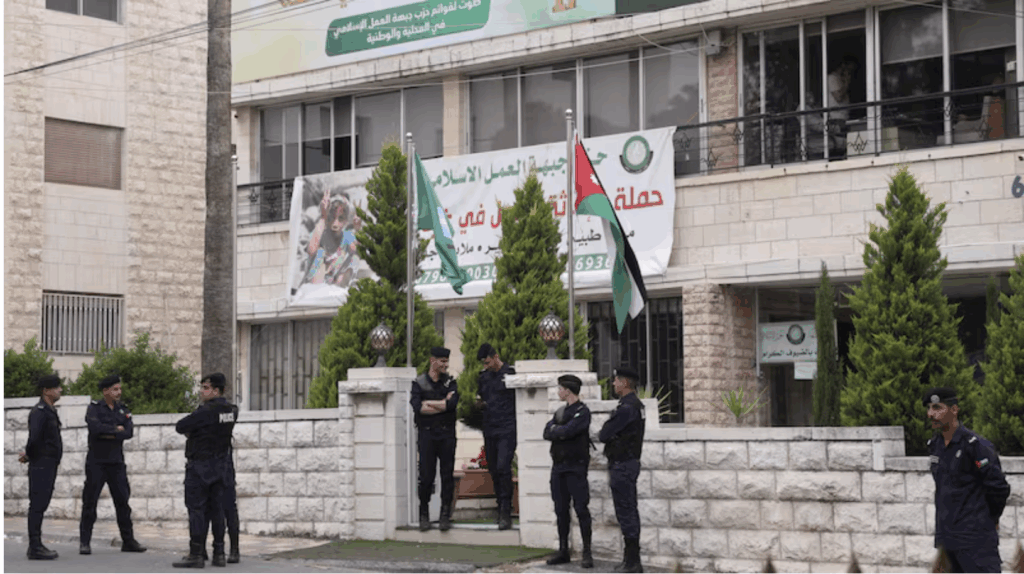 Jordanian police guard an Islamic Action Front office in Amman on the day the ban on the Muslim Brotherhood was announced. | PHOTO/ REUTERS.