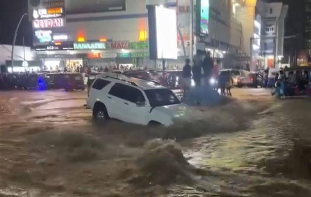 Vehicle and people inside trapped as the heavy flooding washed the road roads. Vehicle and people inside trapped as the heavy flooding washed the road roads.