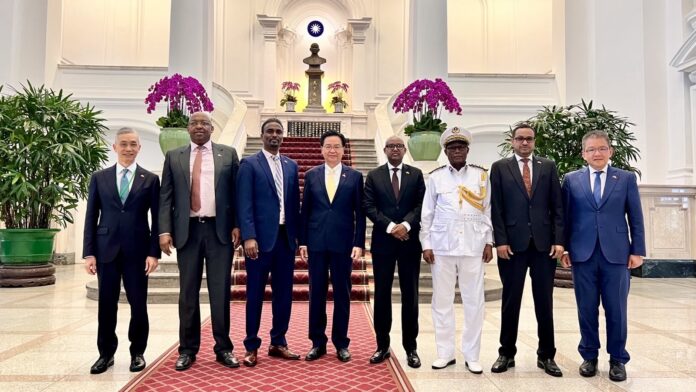 Somaliland foreign minister Abdirahman Aden poses for a photo with Taiwanese foreign ministry officials during a visit to Taiwan.