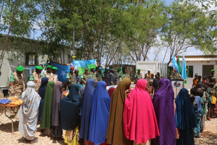 PHOTO FILE Djibouti soldiers seen donating clothes and food to local women in Hiiraan region, central Somalia June, 2024.