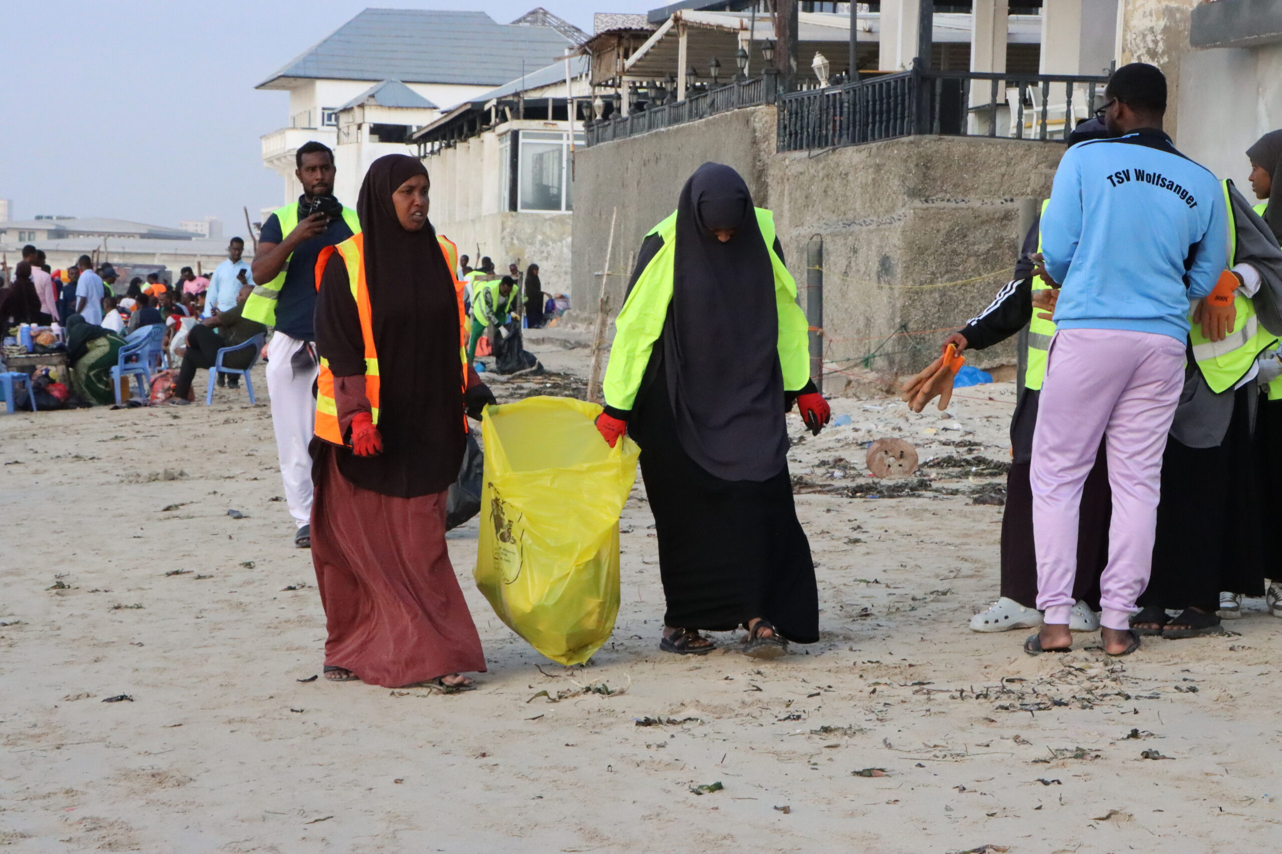 Young university students spend their weekends clearing waste from Mogadishu's Lido Beach, as Somalia battles the compounding toll of climate change, toxic dumping, and coastal degradation. | PHOTO/Said Yusuf Warsame.
