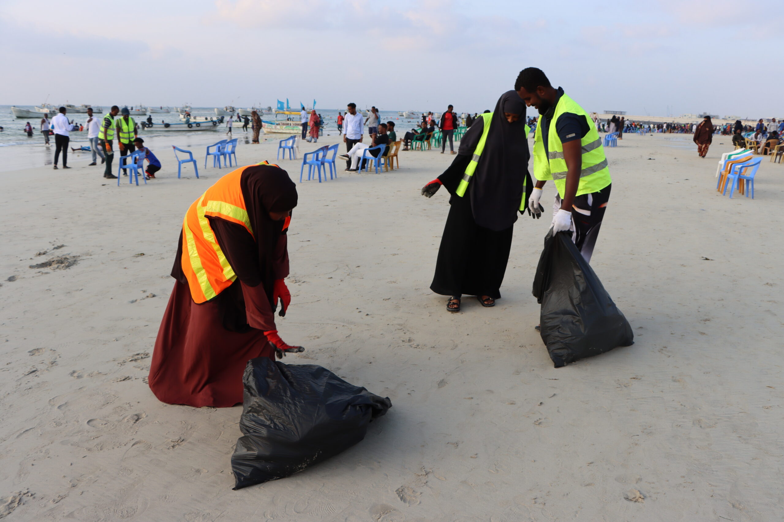 Young university students spend their weekends clearing waste from Mogadishu's Lido Beach, as Somalia battles the compounding toll of climate change, toxic dumping, and coastal degradation. | PHOTO/Said Yusuf Warsame.