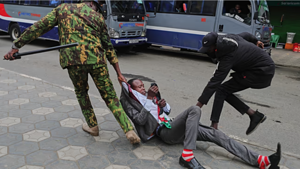 A Protestor Being Dragged through the streets By Kenyan Police |PHOTO| African Front.